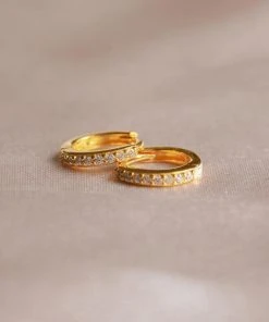 Astridandmiyu Birthstone Earrings April Birthstone Huggies In Gold With Clear CZ