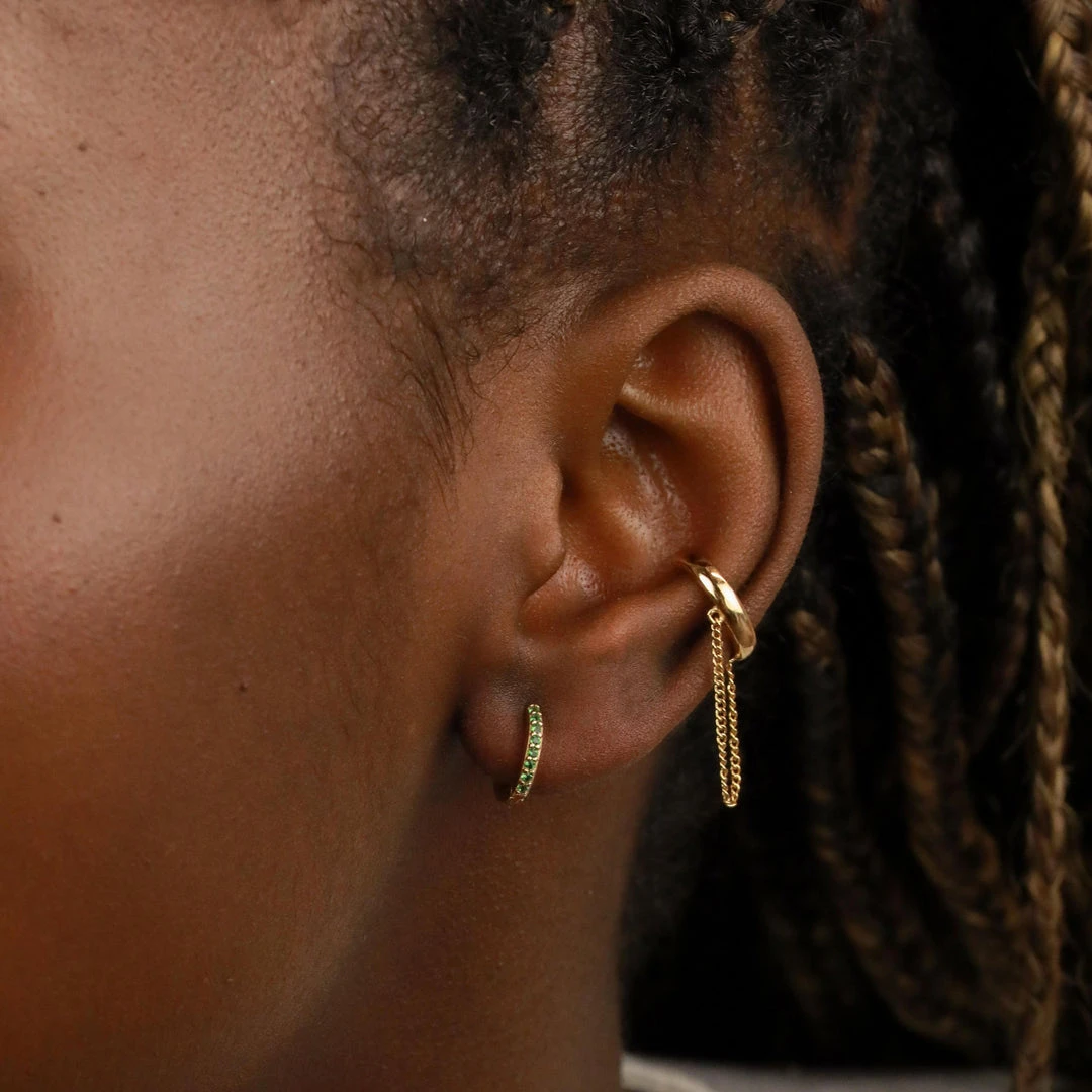 Astridandmiyu Best Sellers May Birthstone Huggies In Gold With Emerald CZ 7 Astridandmiyu Best Sellers May Birthstone Huggies In Gold With Emerald CZ