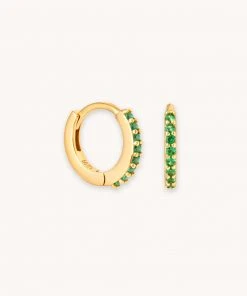 Astridandmiyu Best Sellers May Birthstone Huggies In Gold With Emerald CZ