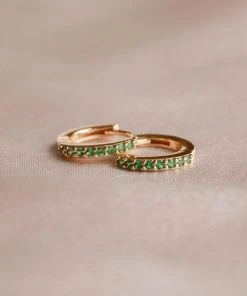 Astridandmiyu Best Sellers May Birthstone Huggies In Gold With Emerald CZ 10 Astridandmiyu Best Sellers May Birthstone Huggies In Gold With Emerald CZ