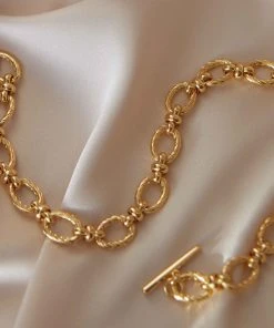 Astrid & Miyu Textured Oval Link T-Bar Bracelet In Gold